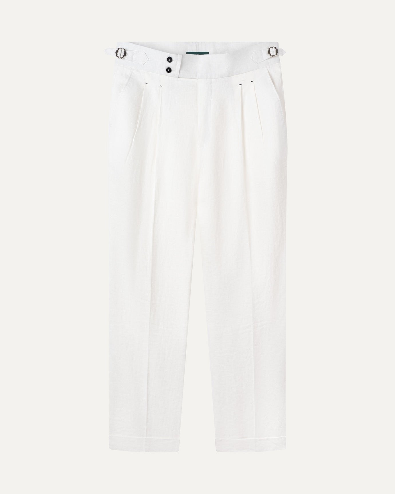 Woman with lightweight neutral capsule wardrobe pieces packed minimally