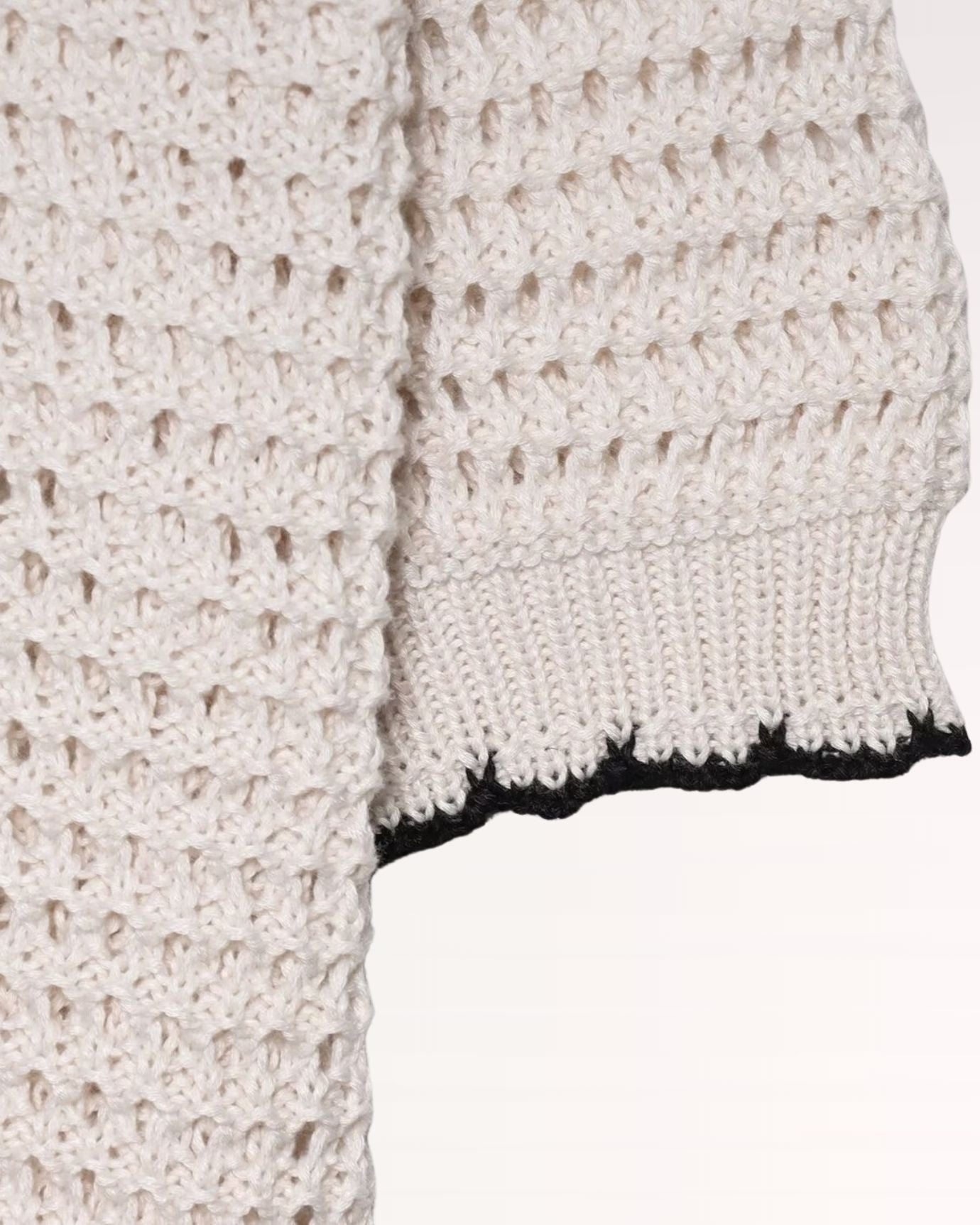 Classic polo collar featuring delicate crochet pattern