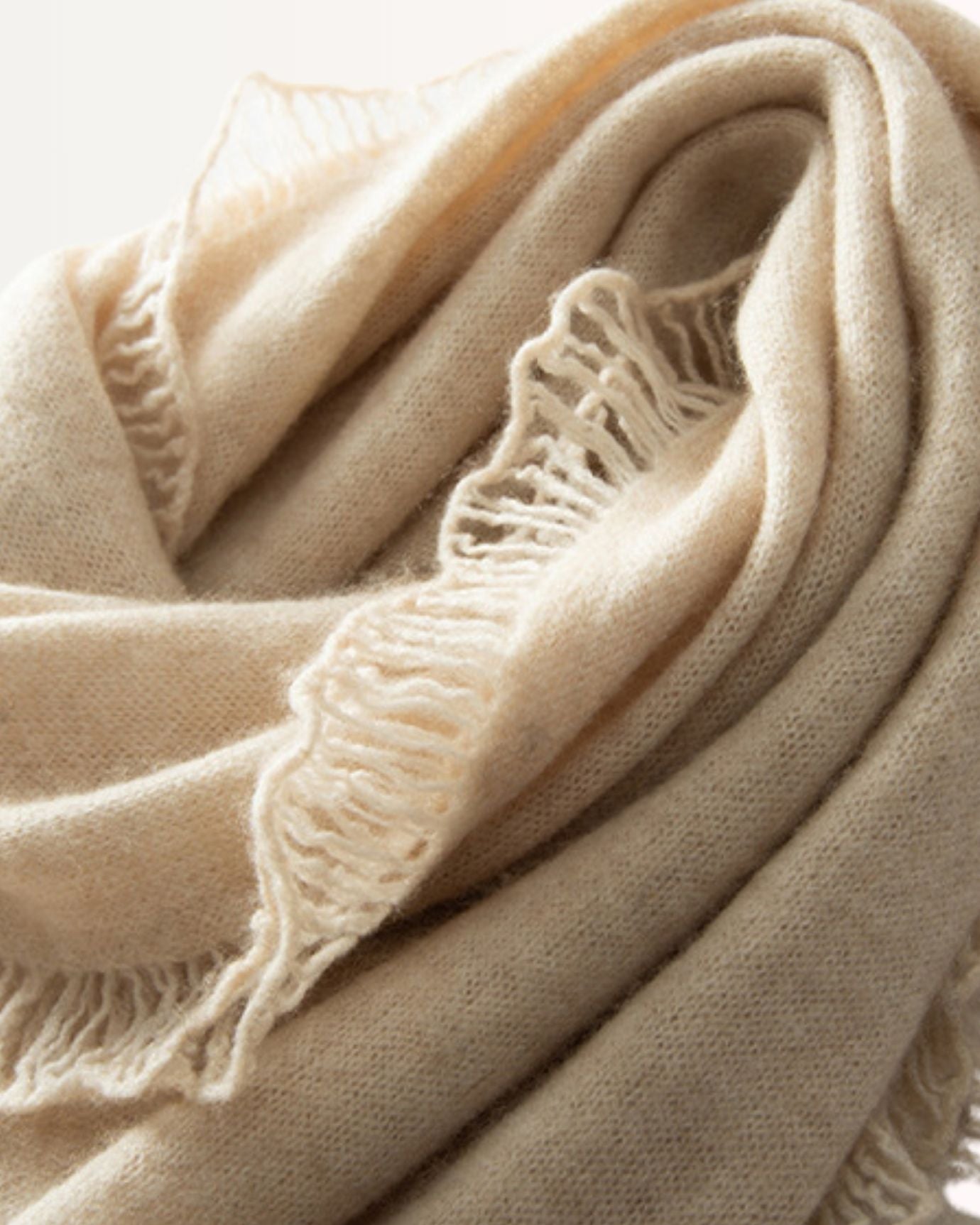 Soft beige cashmere scarf for feminine winter style