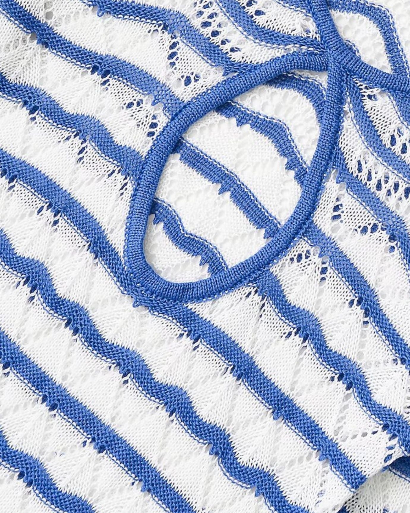 Striped summer dress with cut-out details, perfect for seaside getaways