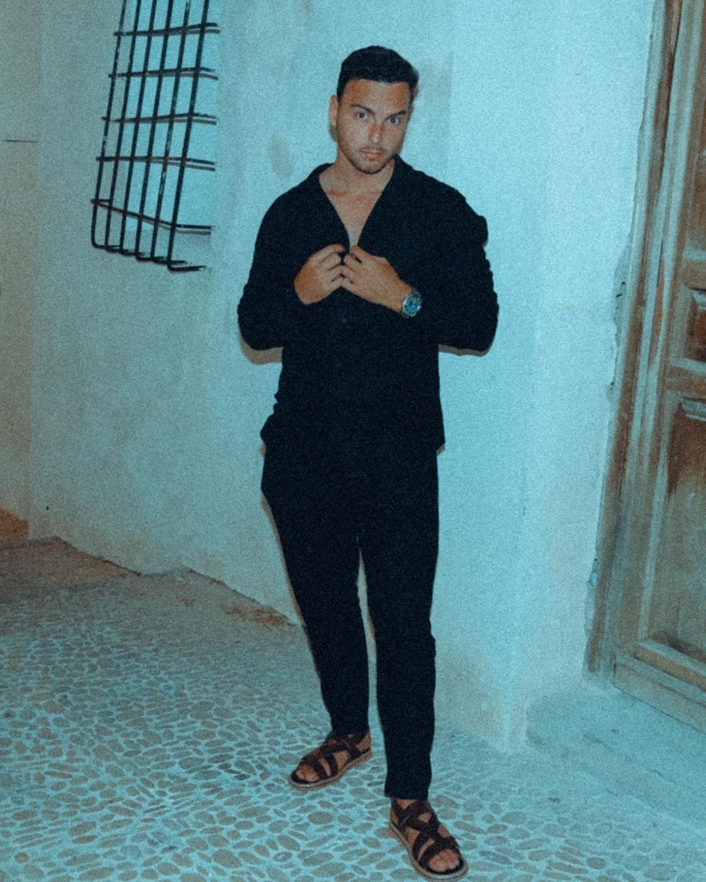 Model wearing Old Money Dolce Vita black trousers paired with classic shirt