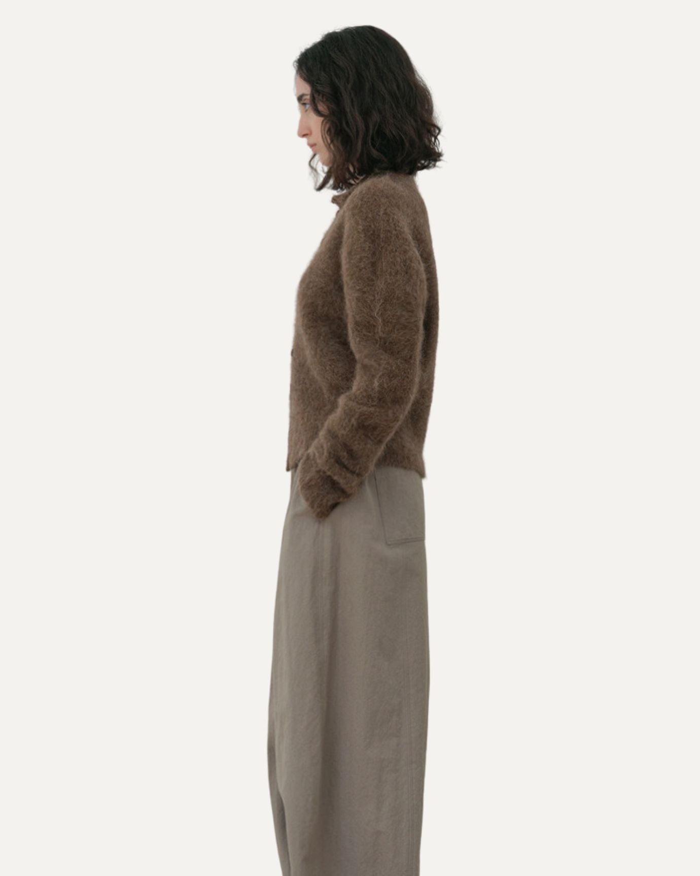 Side profile of Aus Alpaca Sweater Cardigan showing ribbed cuffs and relaxed fit