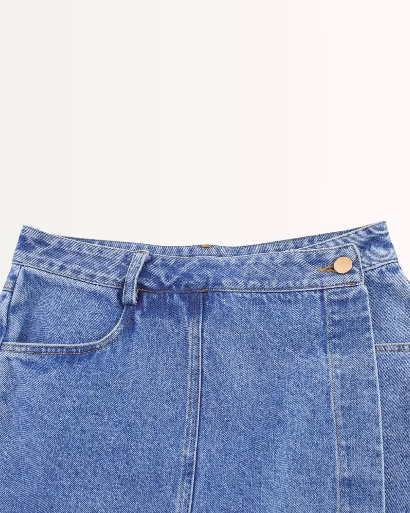 Mid-length denim skirt with subtle faded wash and durable fabric texture