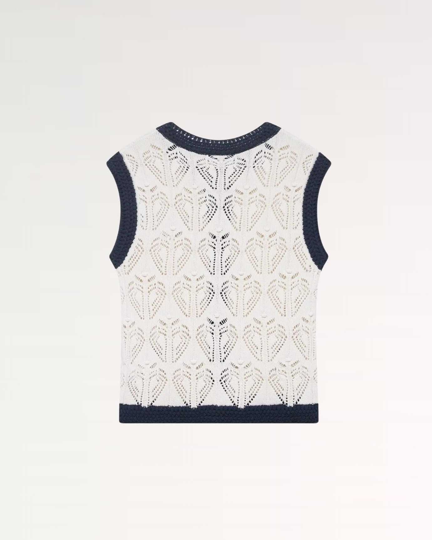 Luxurious sleeveless vest with detailed jacquard weave complemented by lightweight mesh inserts
