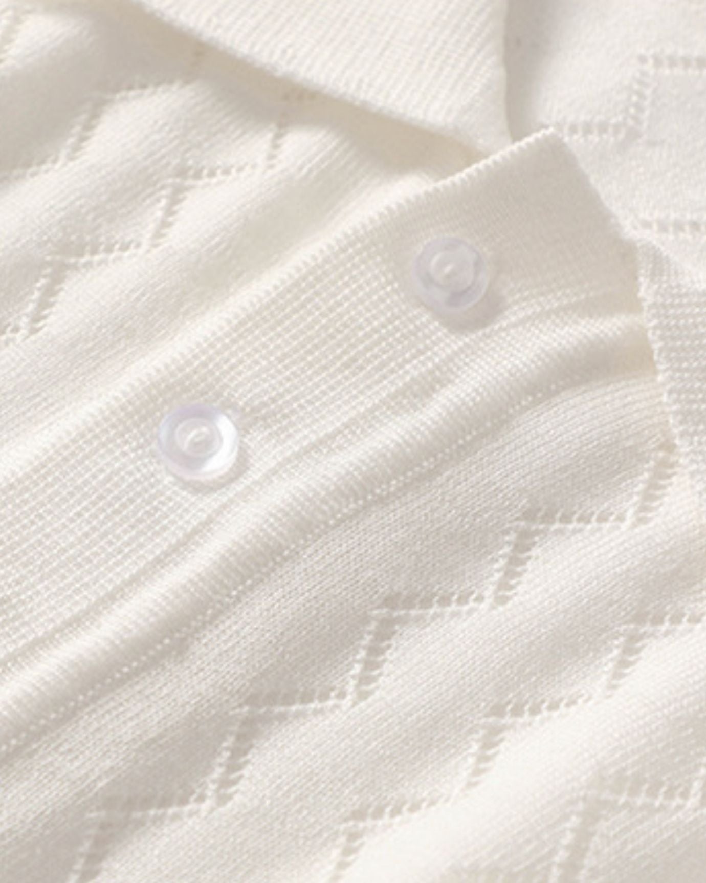 Detail of collar and fine knit texture on White cashmere silk polo