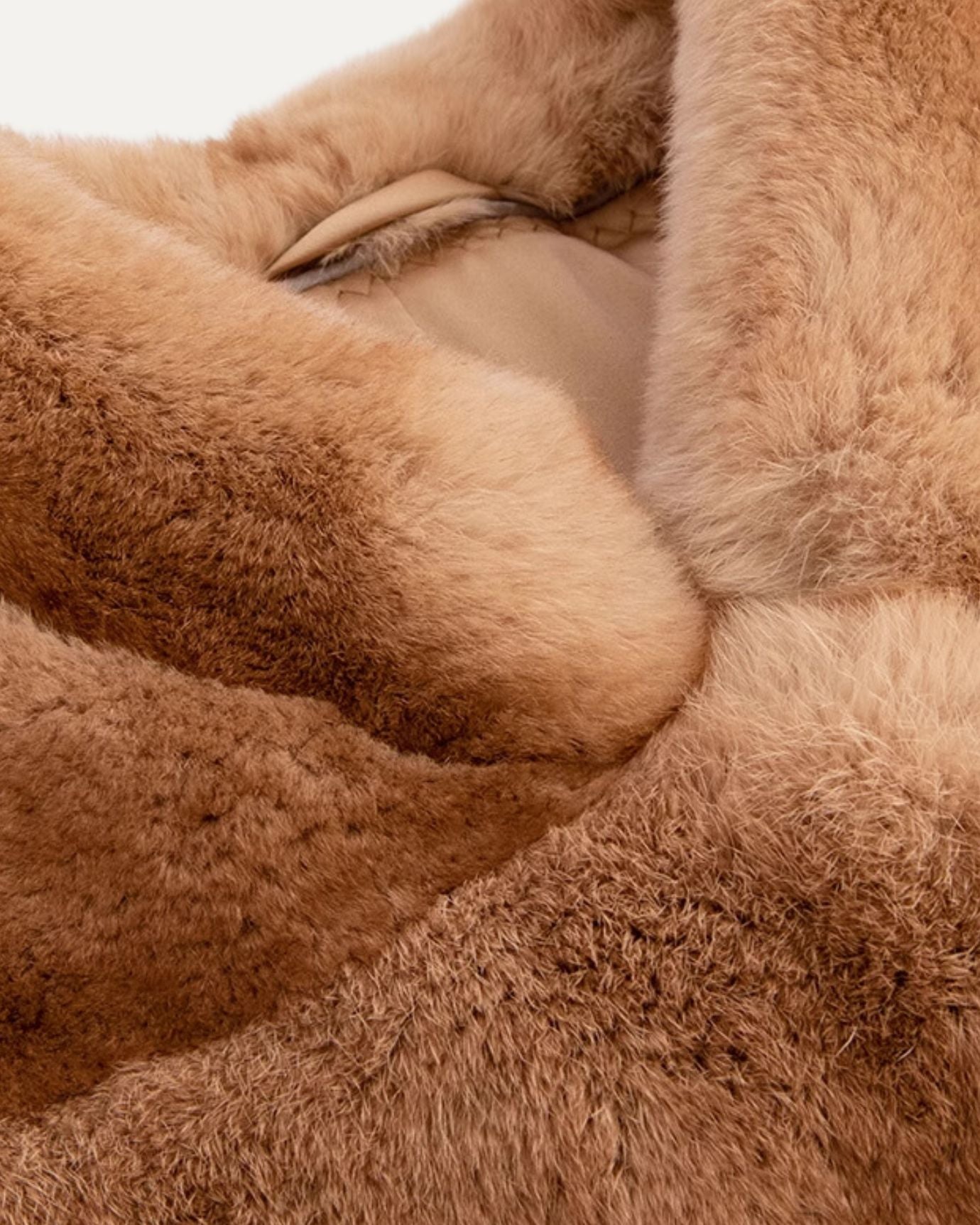 Interior lining and stitching of Lovau x Sense rabbit coat