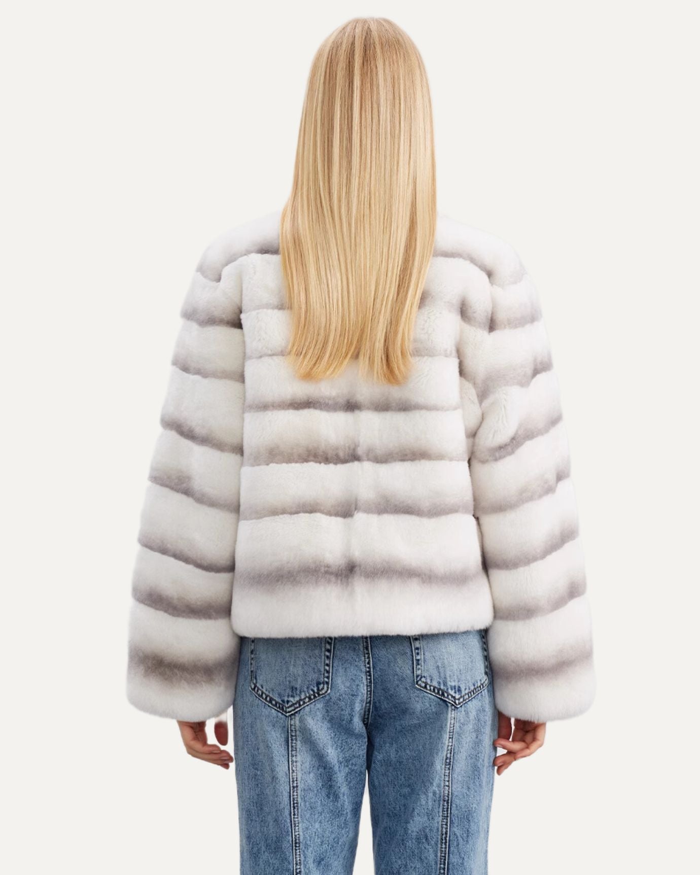 Rabbit fur coat styled with wide-leg trousers and ankle boots