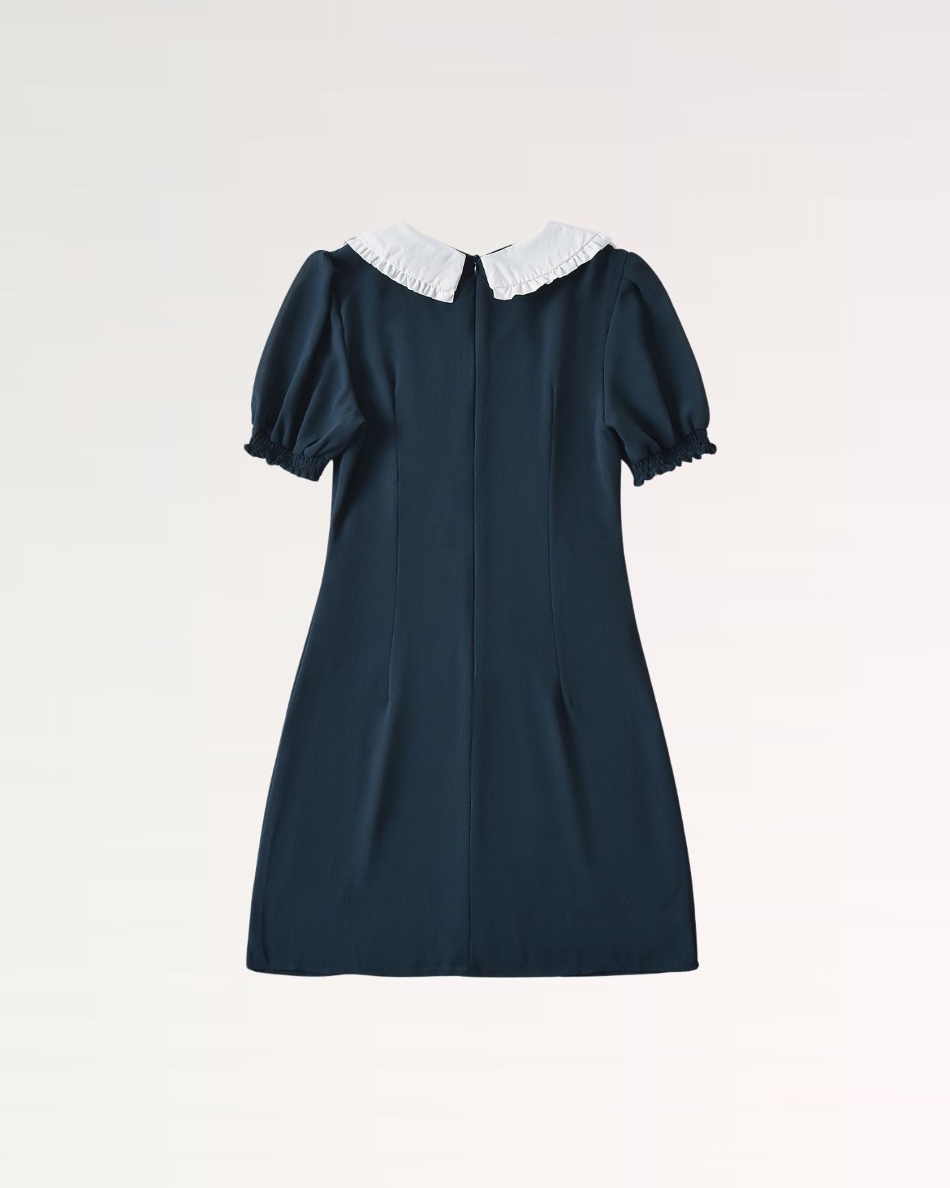 Sophisticated long dress featuring raised waistline and flowing skirt