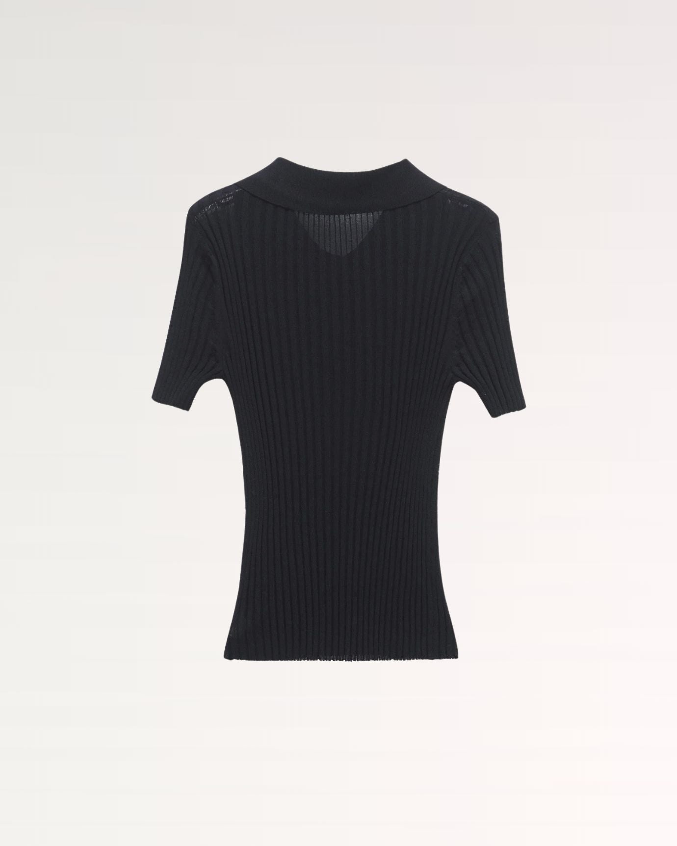back view showing smooth knit finish and tailored fit of woolen polo