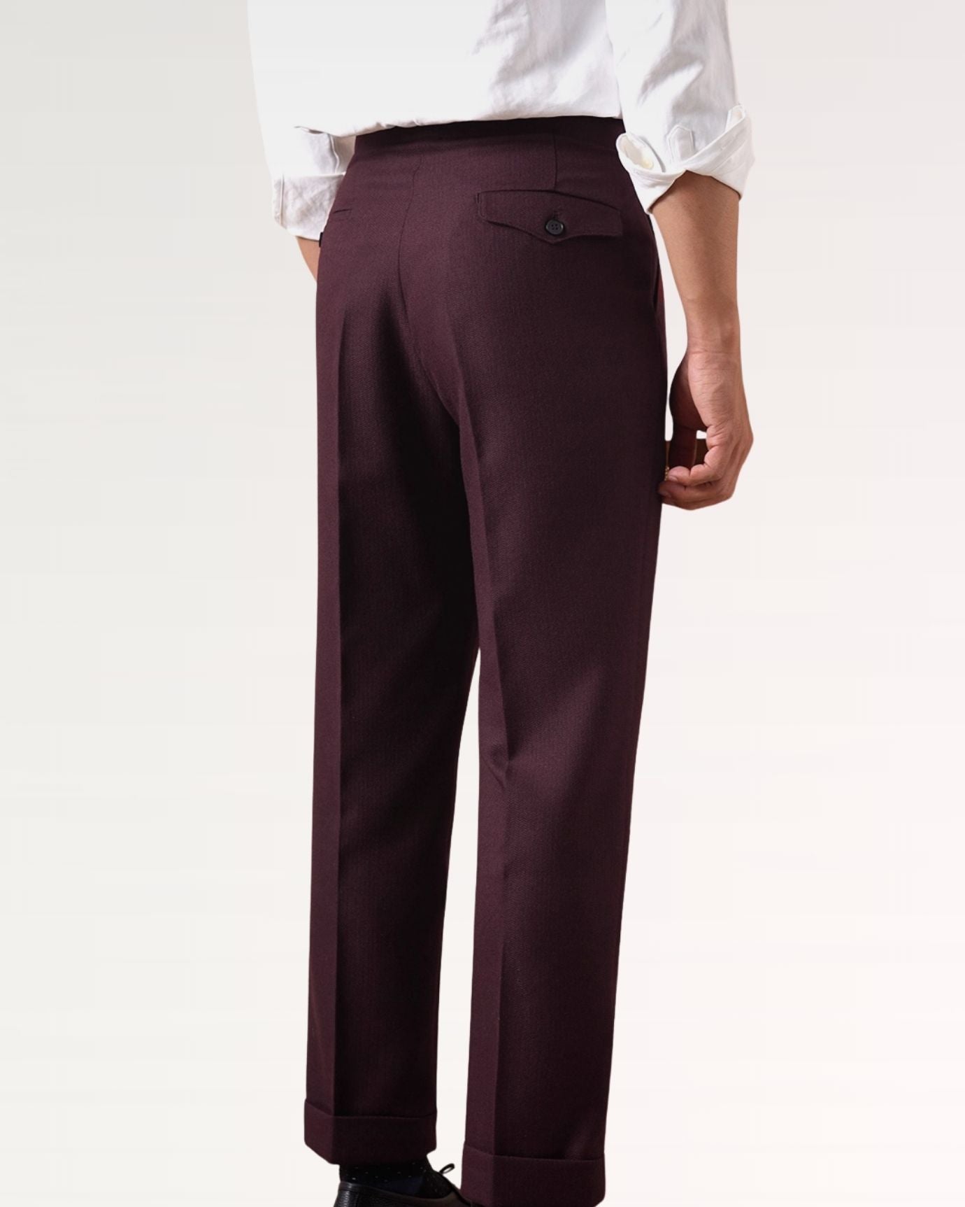Back of burgundy business trousers showing clean seams and flat pockets
