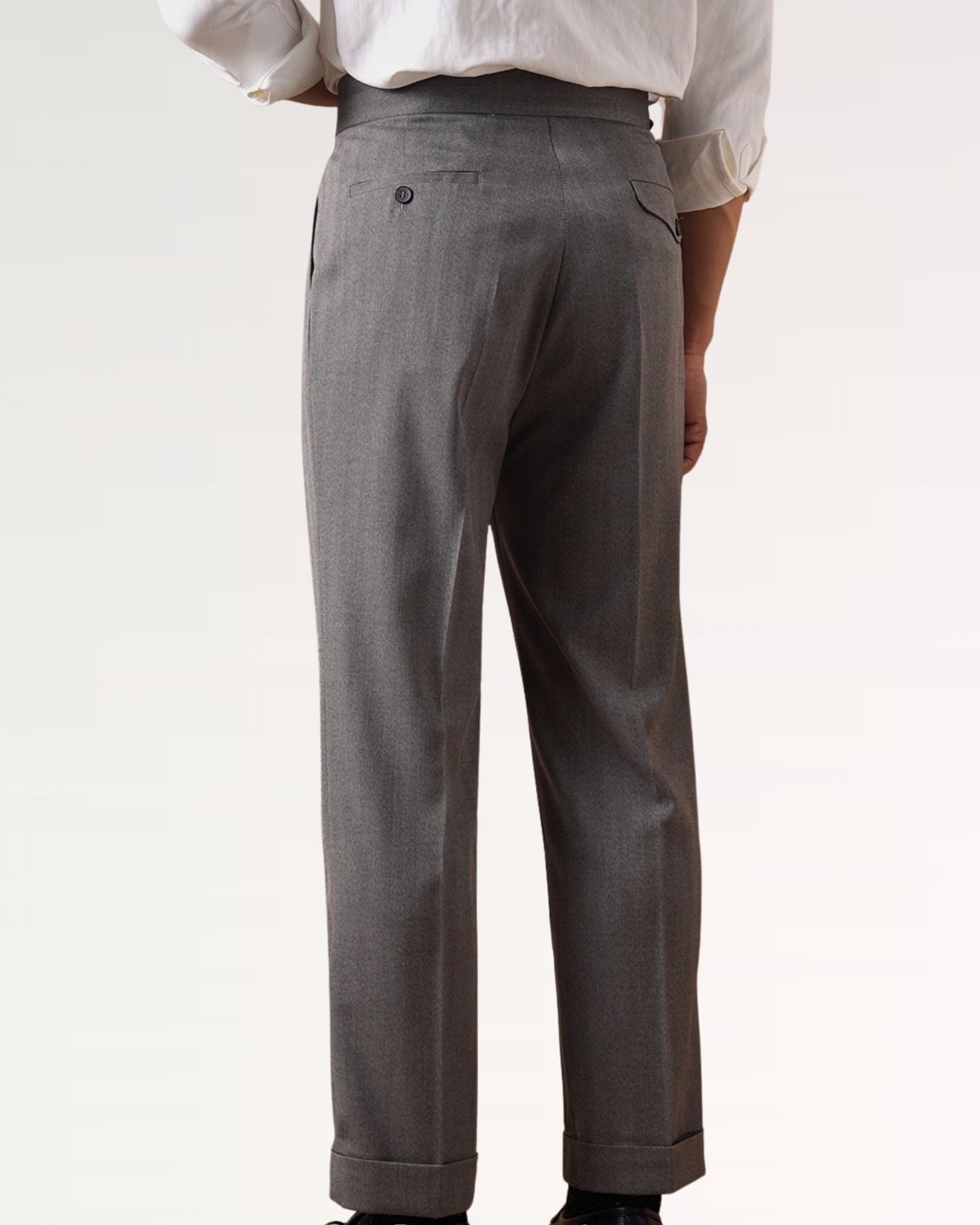 Back of tailored business trousers showing clean seams and welt pockets