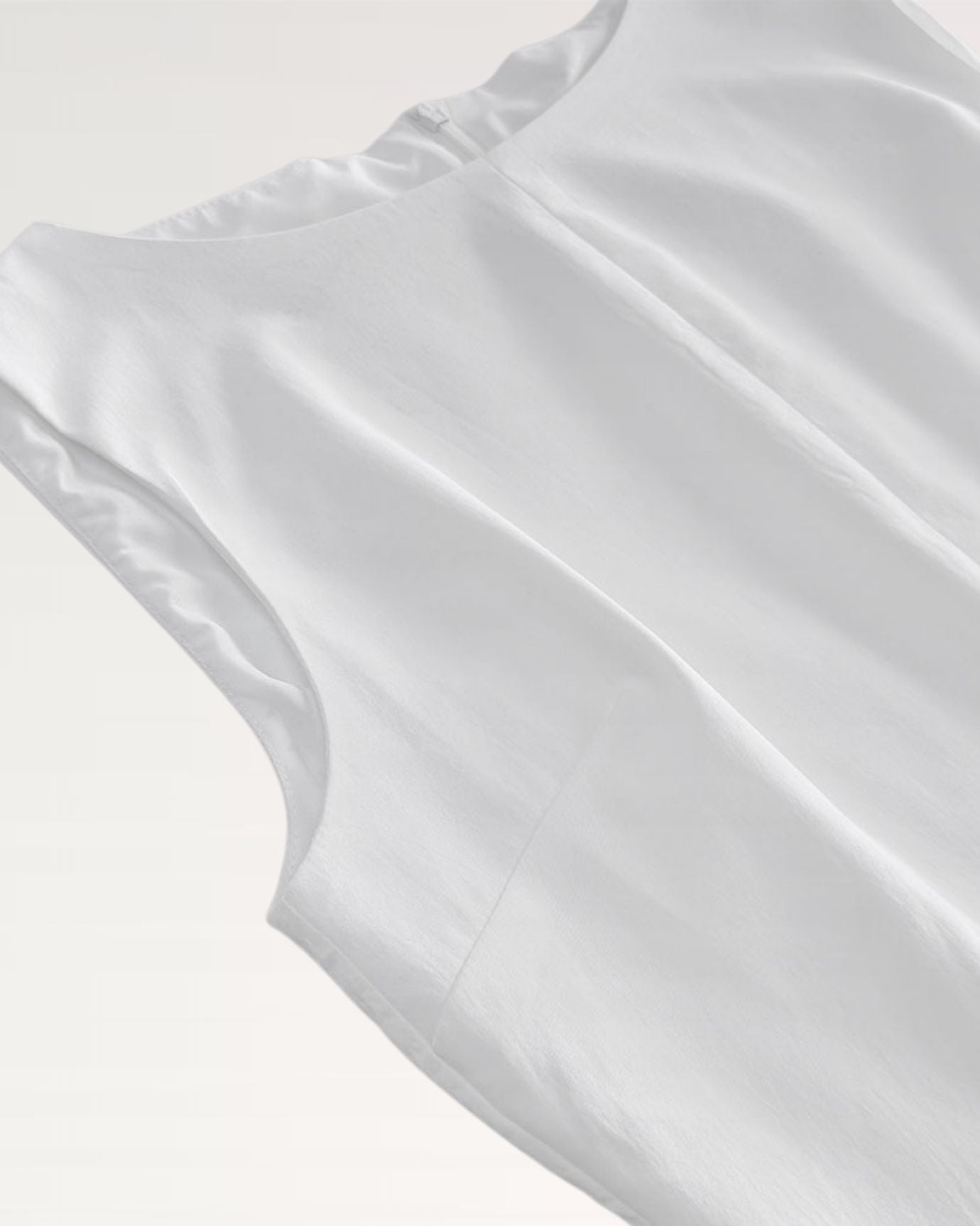 Soft white dress with flattering neckline and fitted bodice