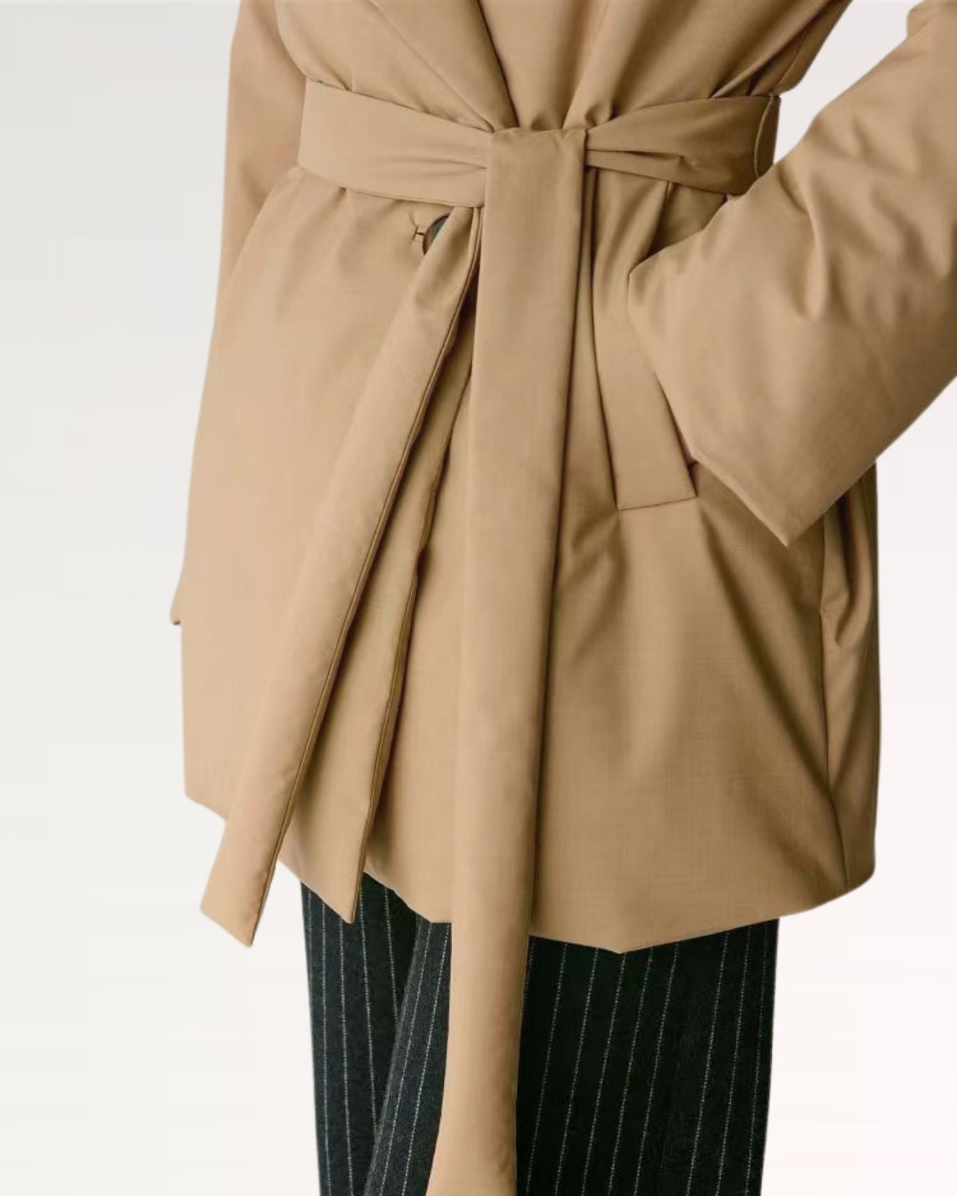 Elegant camel jacket featuring a relaxed fit and clean lines