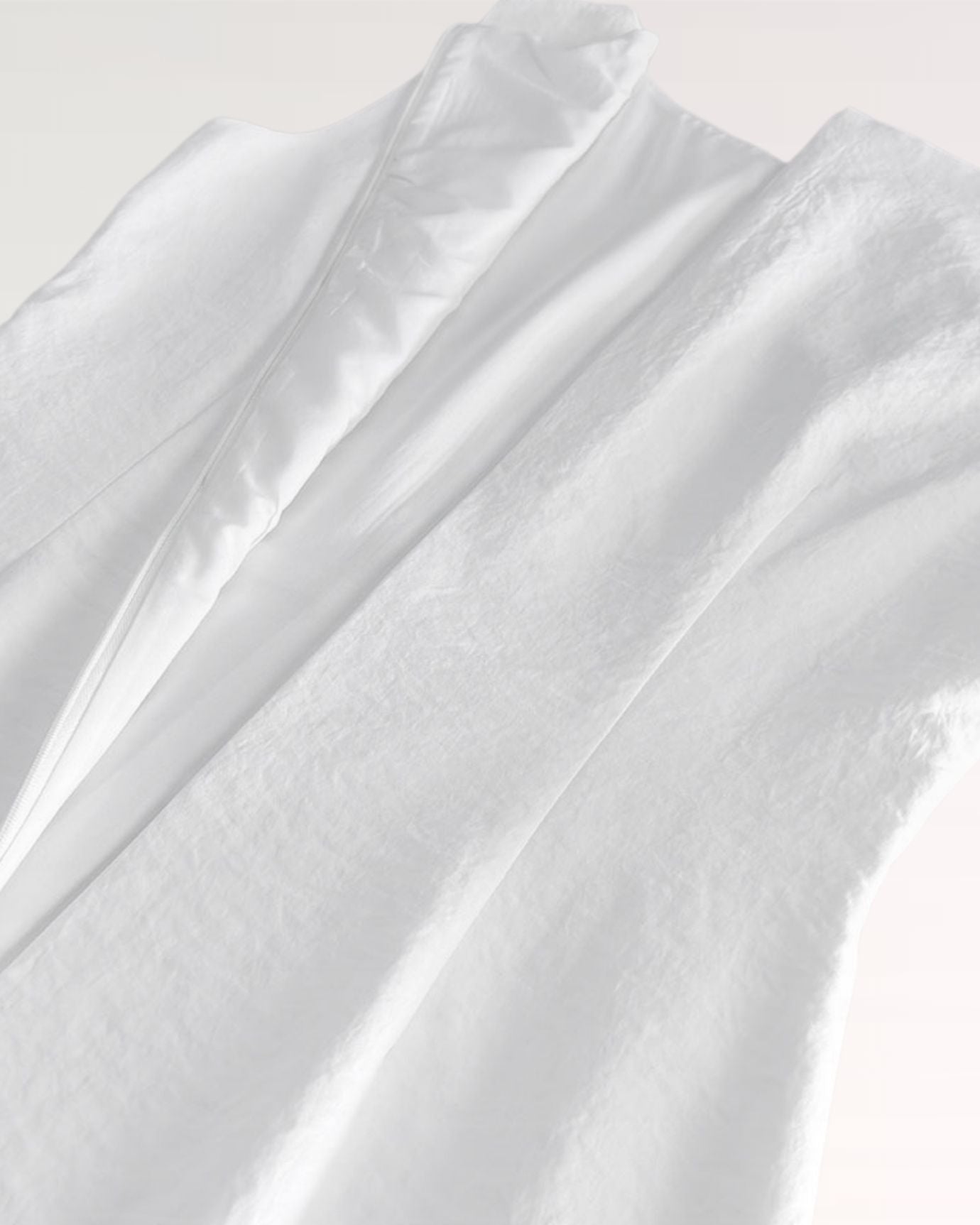 Back detail of white Sofia dress with zipper closure