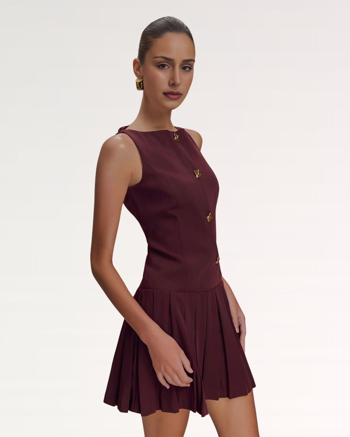 Close-up of refined collar stitching and button details on dress front