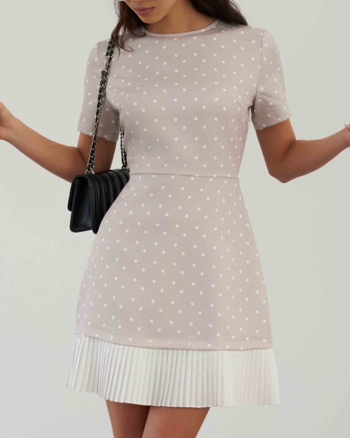 Detail of the flowing hem on Polkadot Ice Silk Dress in light Milk Tea.