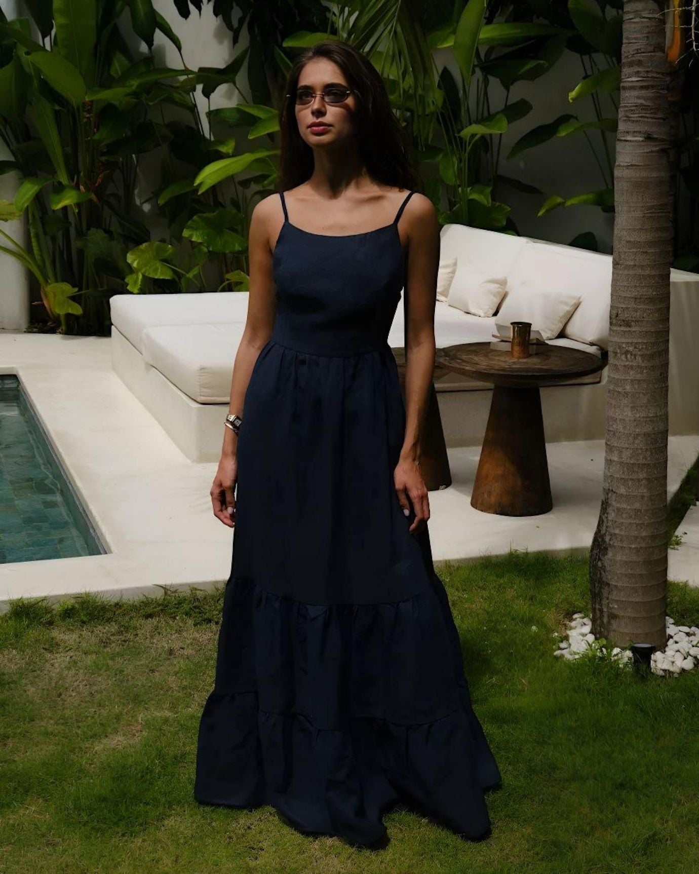 Elegant navy blue Rhi suspender dress with fitted bodice and classic adjustable straps