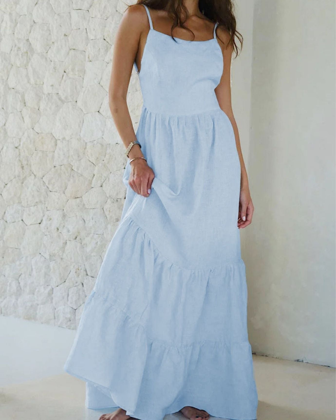 Light blue Rhi suspender dress with adjustable straps and a playful, flowy design