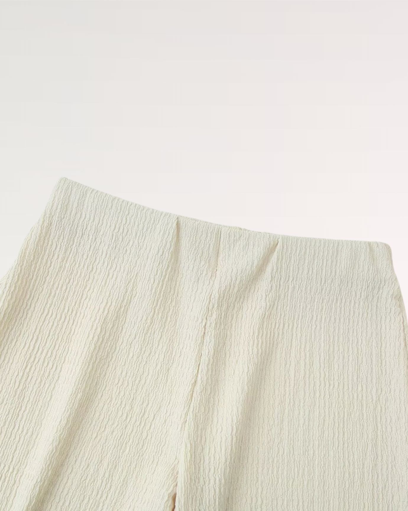 Detailed shot of seams, hems, and delicate stitch work on Tiffany Set Summer
