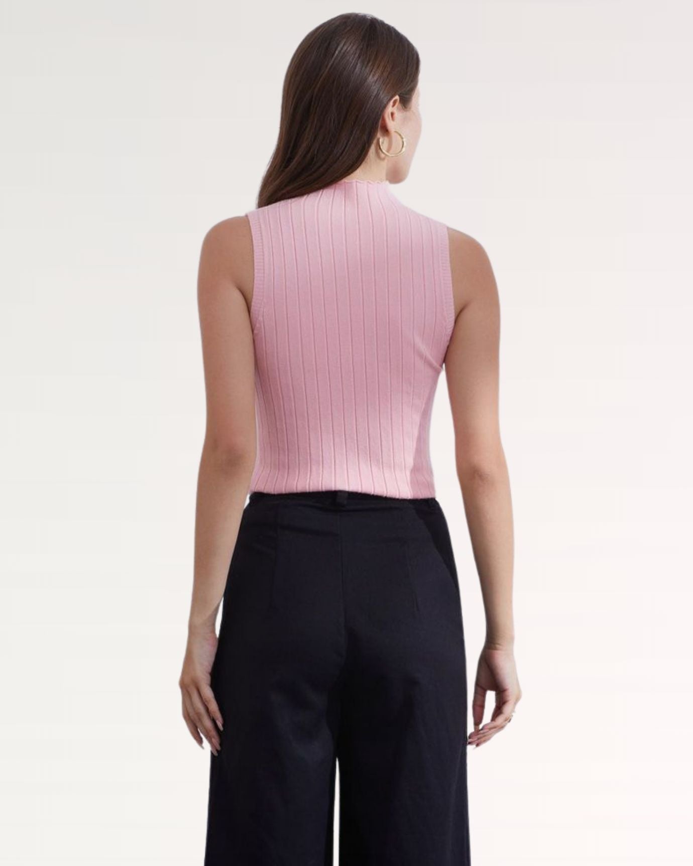 Back view of sleeveless knitted vest shirt in gentle Pink shade