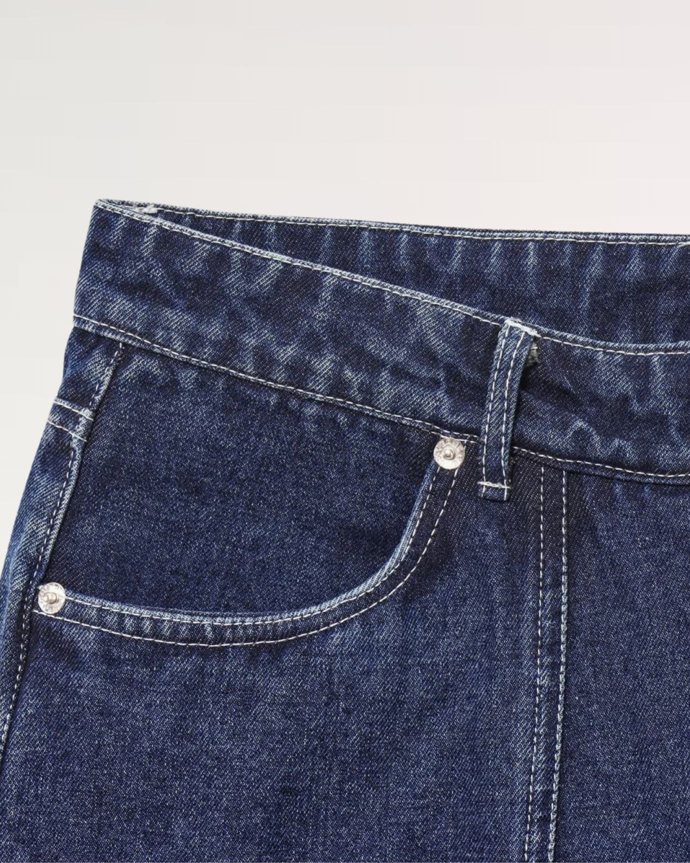 Knee-length navy blue denim skirt with belt loops