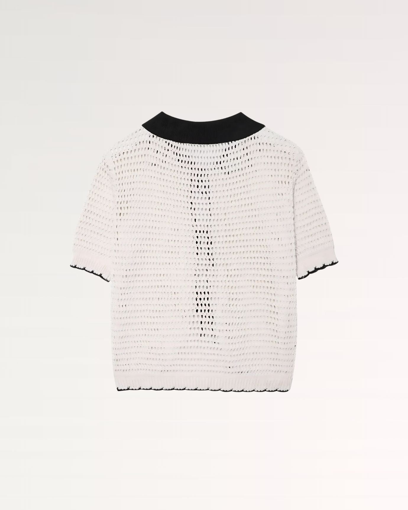 Fine crochet detailing on a crisp polo collar