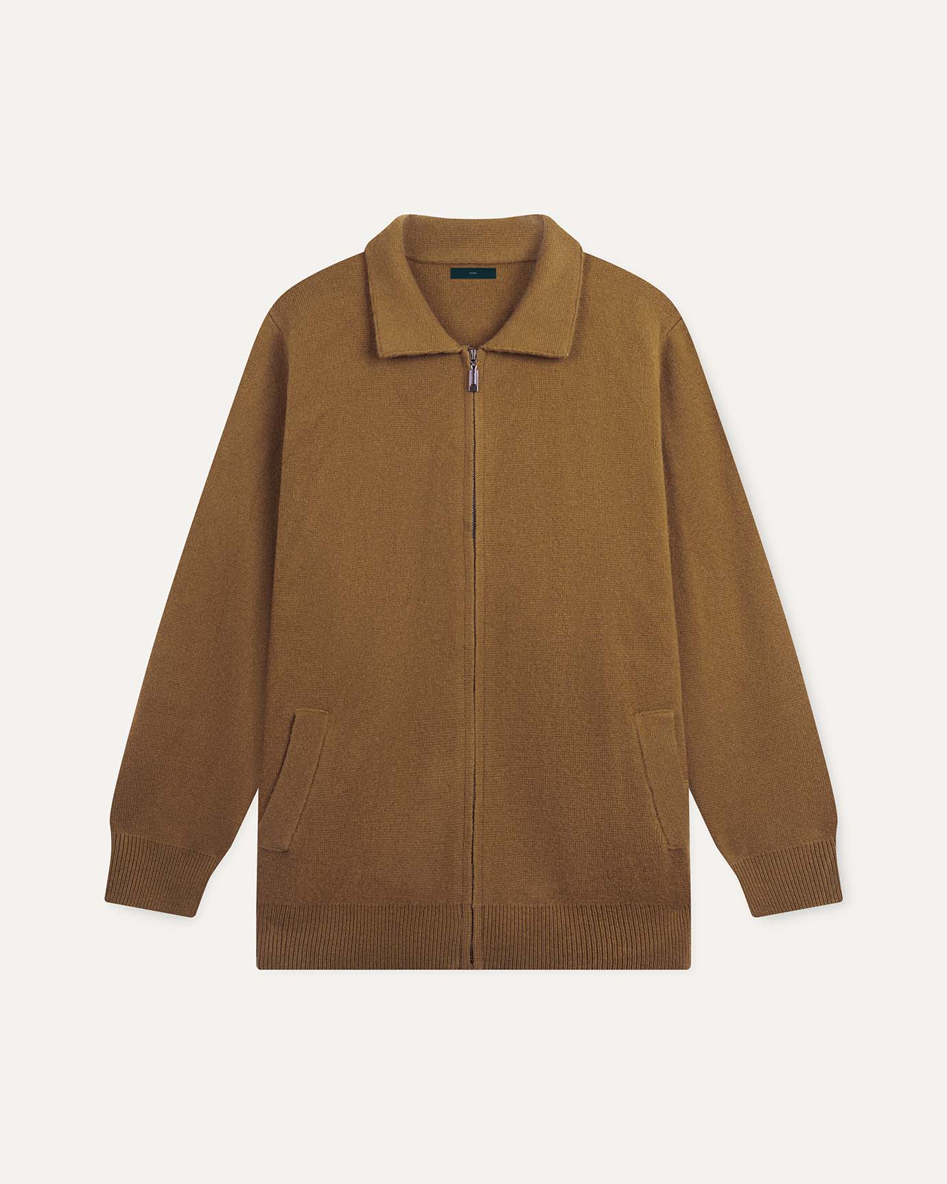 Brown zip-up sweater on a light beige background