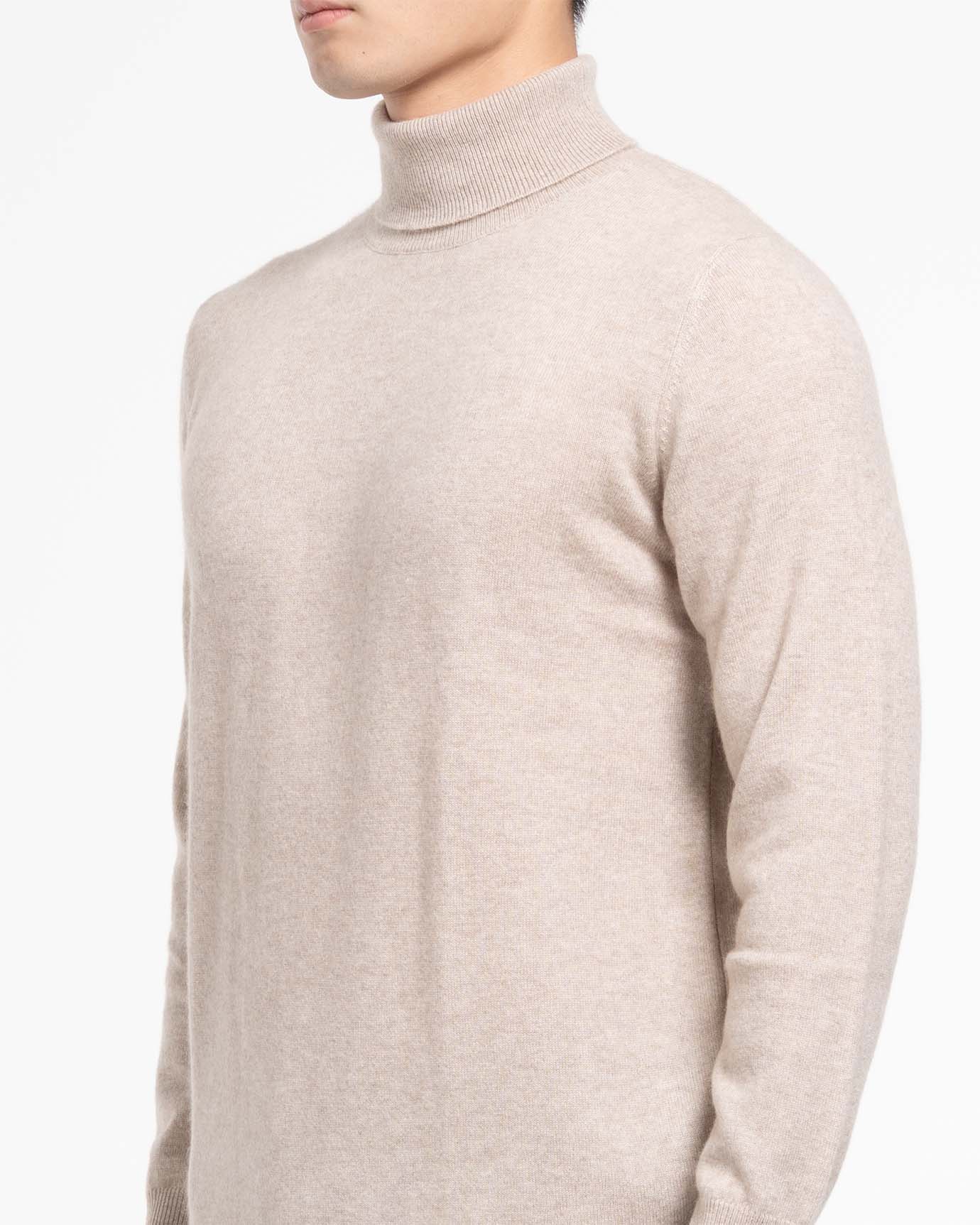 Soft camel-colored turtleneck laid flat for product shot