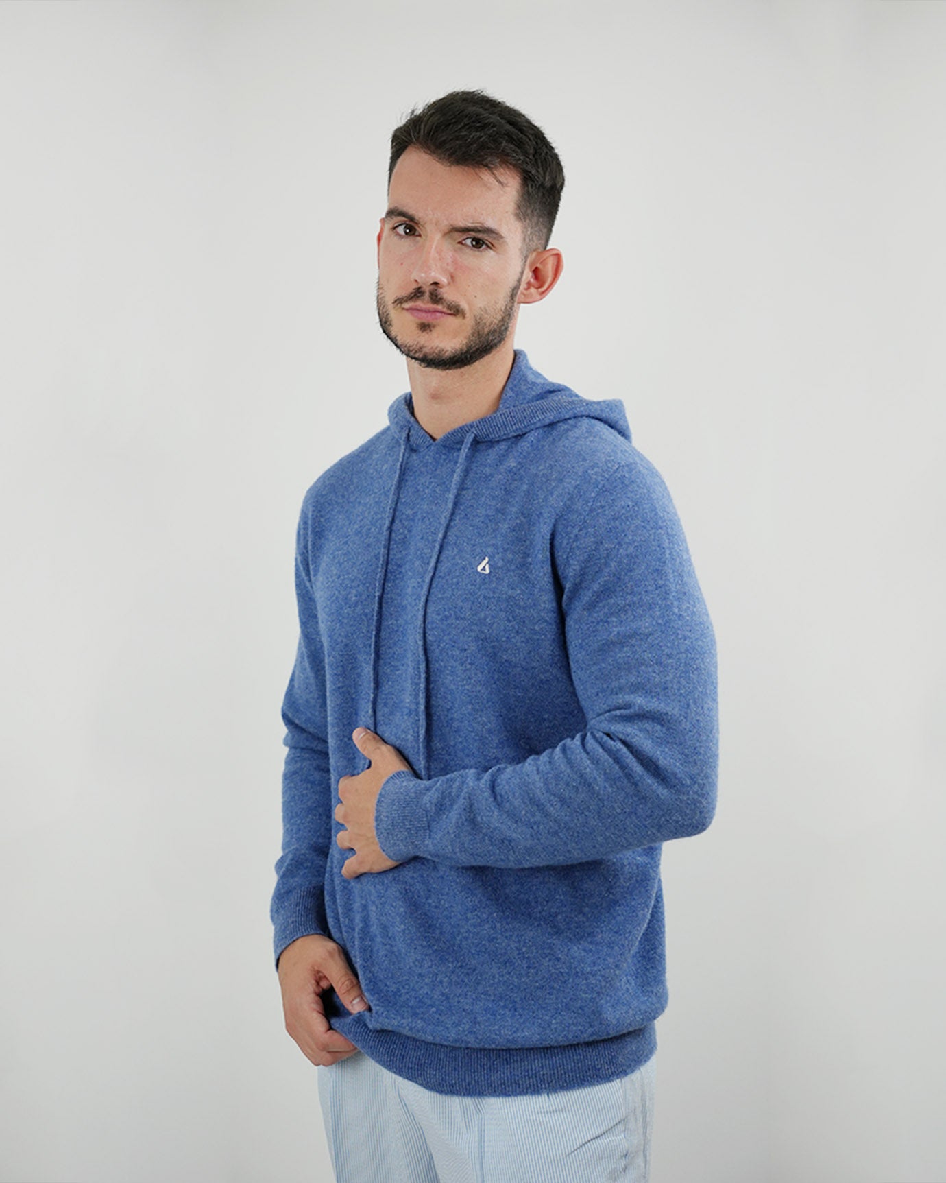 Folded Lovau x Cashmere Hoodie showcasing premium cashmere fiber softness and logo clarity