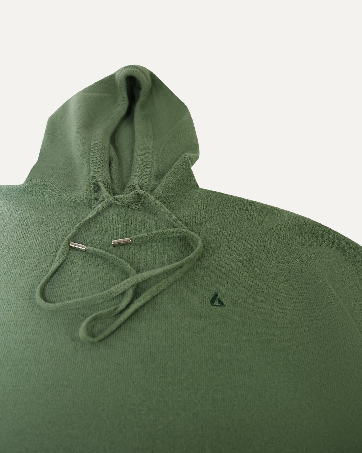 Luxury wool hoodie in forest green with tonal branding