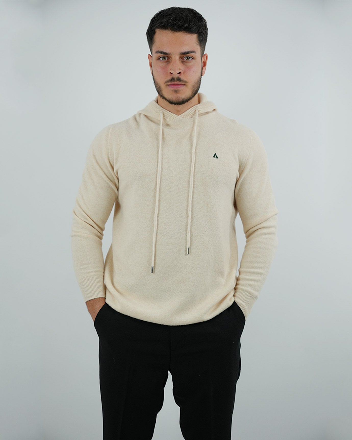 Limited edition beige hoodie with dark green embroidered logo