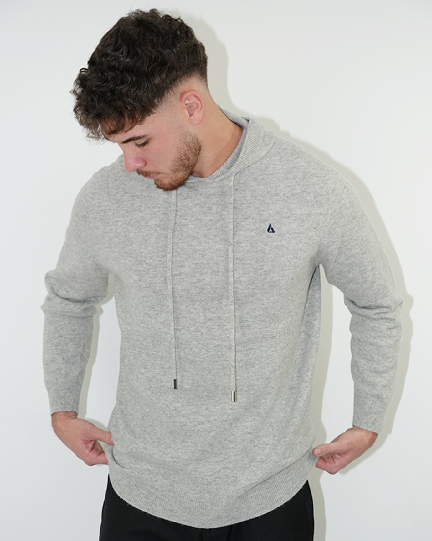 Gray Classy hoodie styled with black trousers and sneakers