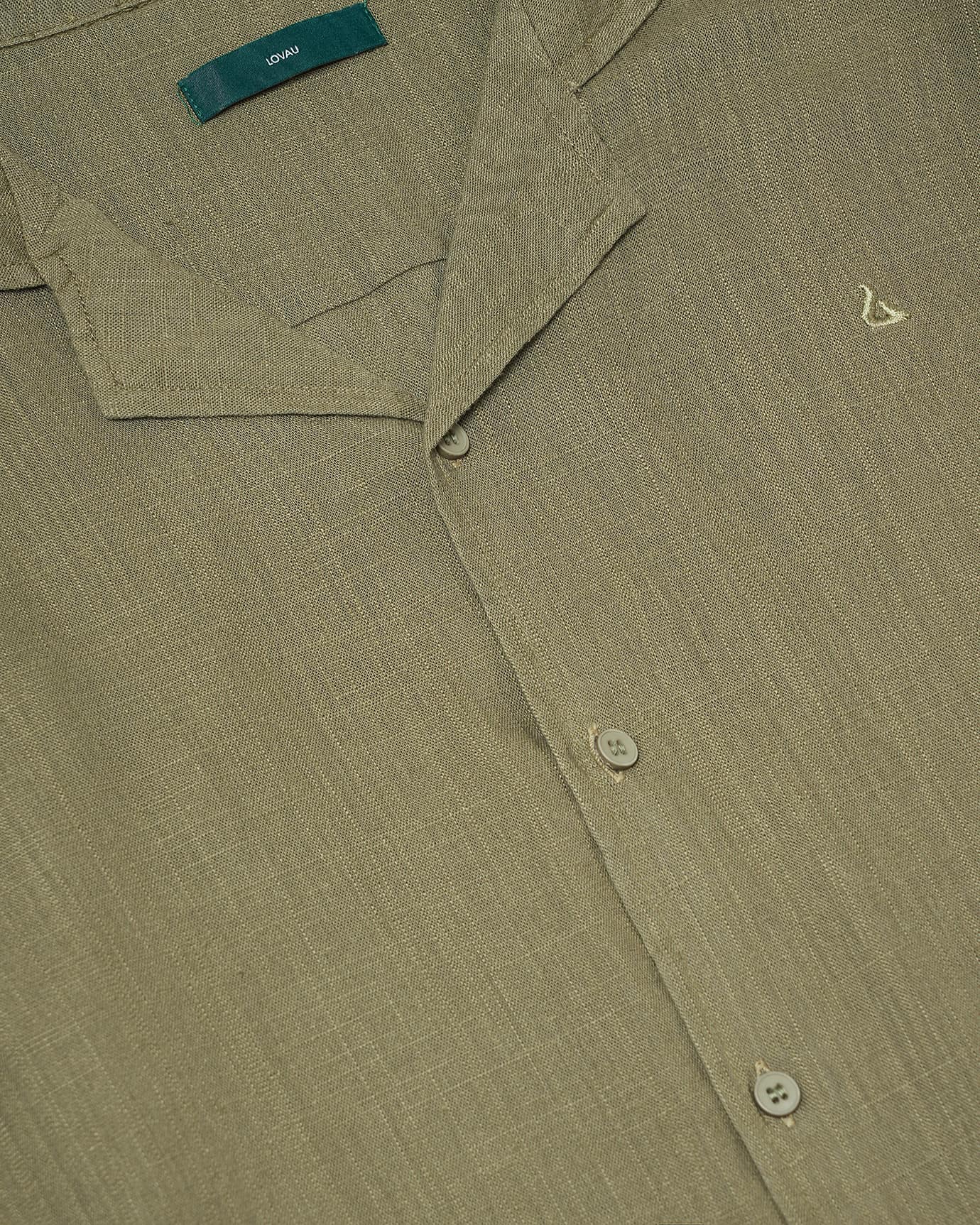 Subtle stitching and smooth finish on soft green Dolce Vita shirt fabric