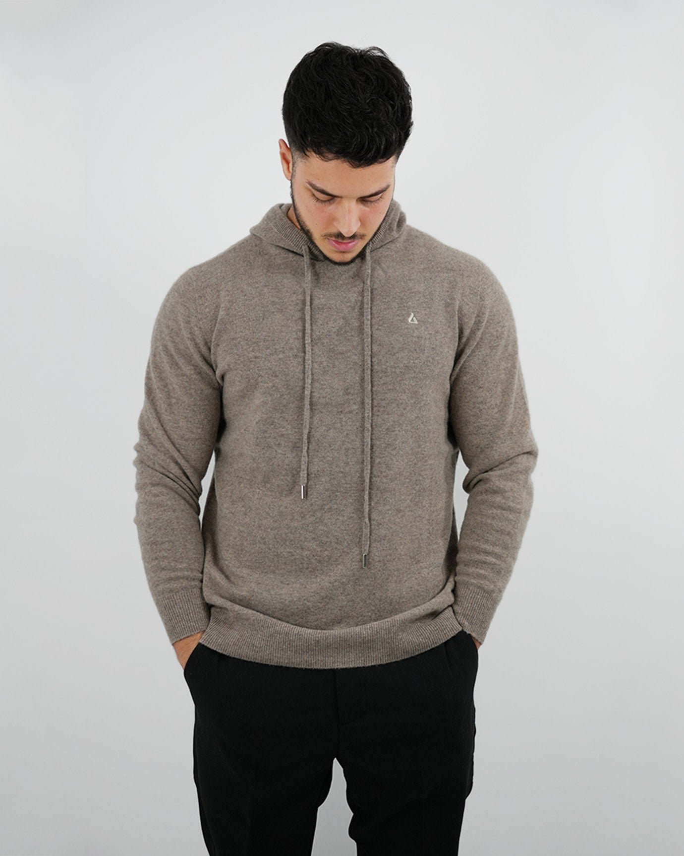 Neutral-toned look with camel hoodie and beige accessories