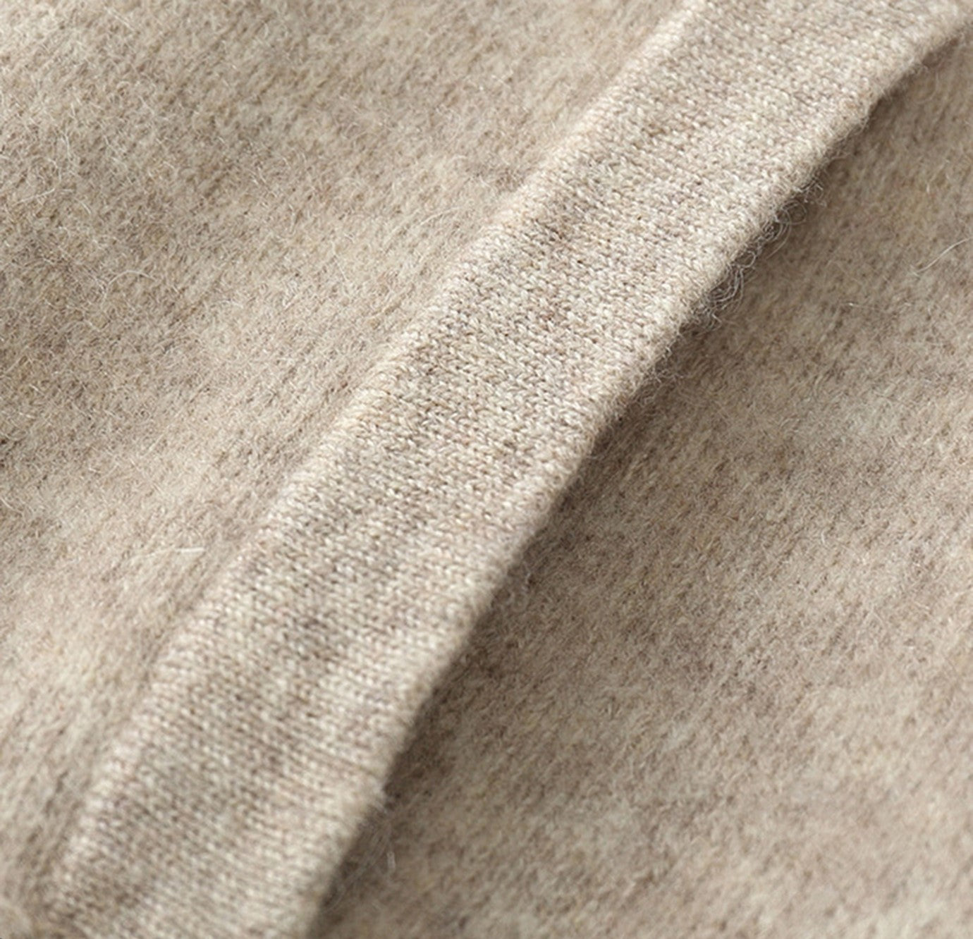 Close-up of round neckline and seam detail on Lovau wool jacket