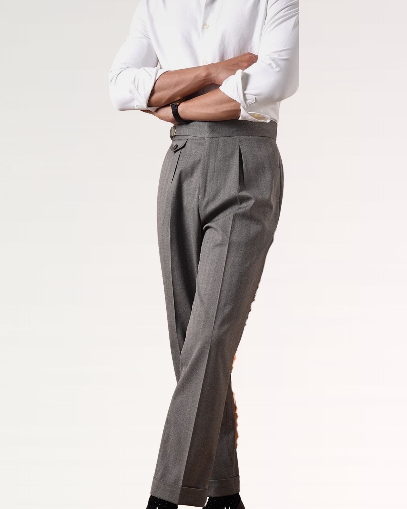 Front view of grey wool blend trousers featuring classic herringbone pattern