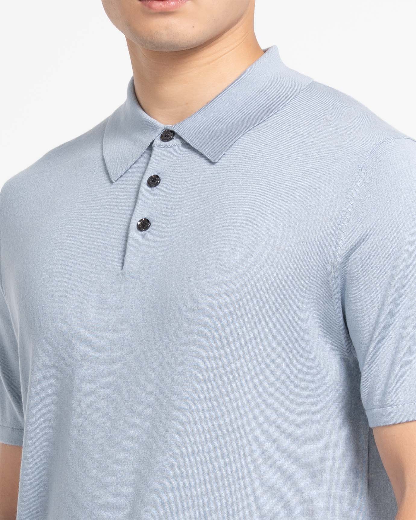 Model wearing cloud blue mulberry silk cashmere short‑sleeve polo