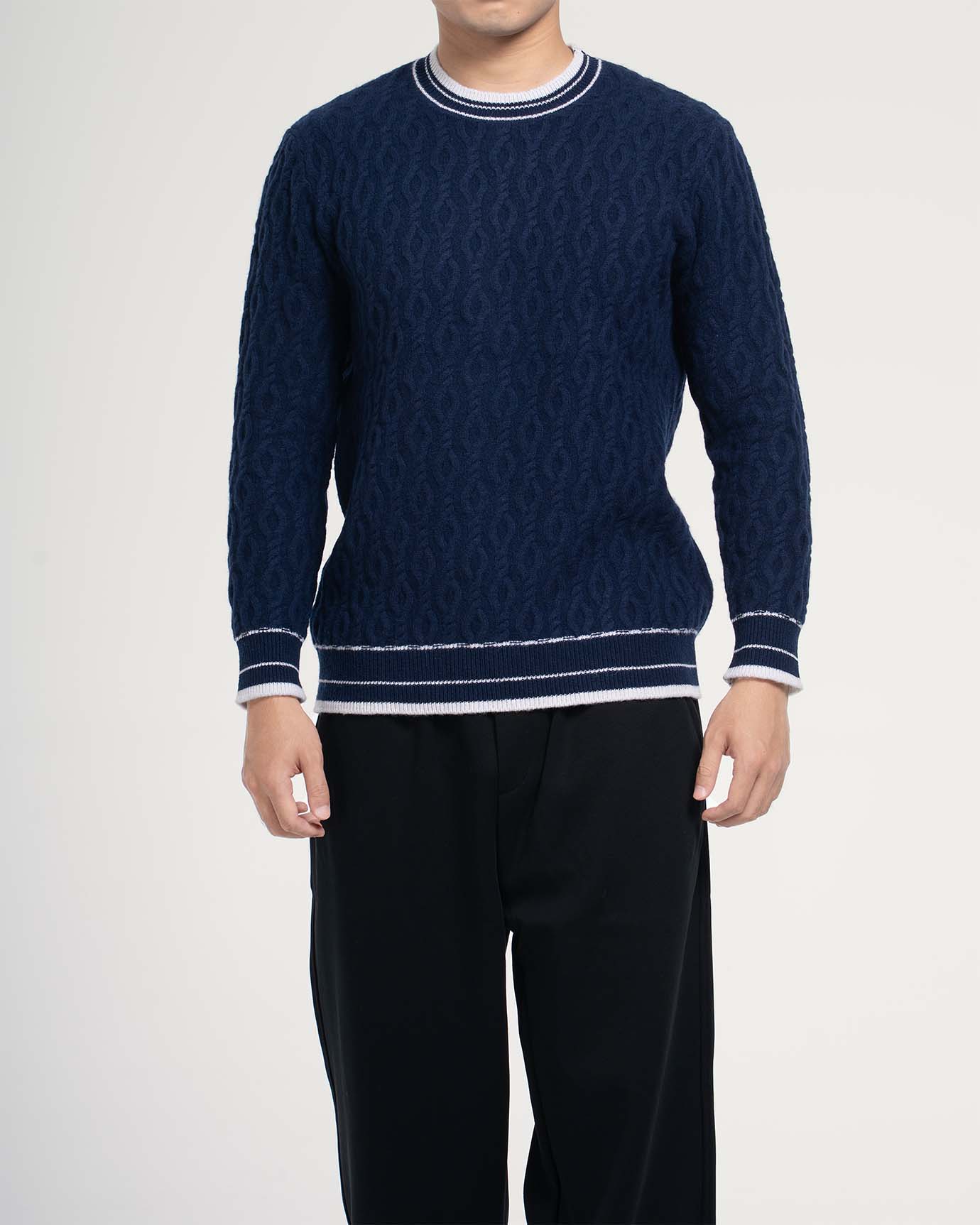 Model outdoors wearing Blue Line Old Money cashmere sweater