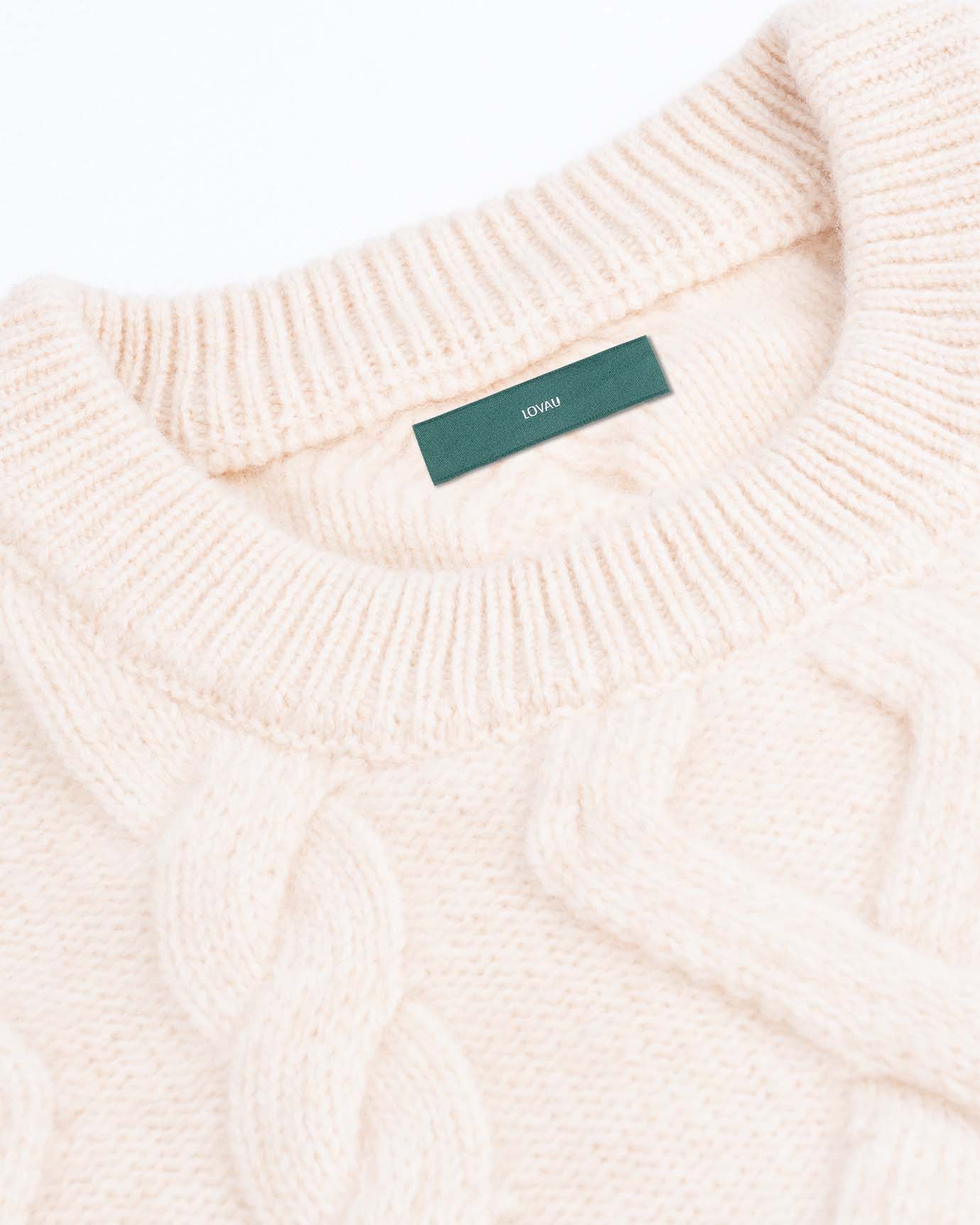 Detail shot of premium pullover’s stitching and soft fabric
