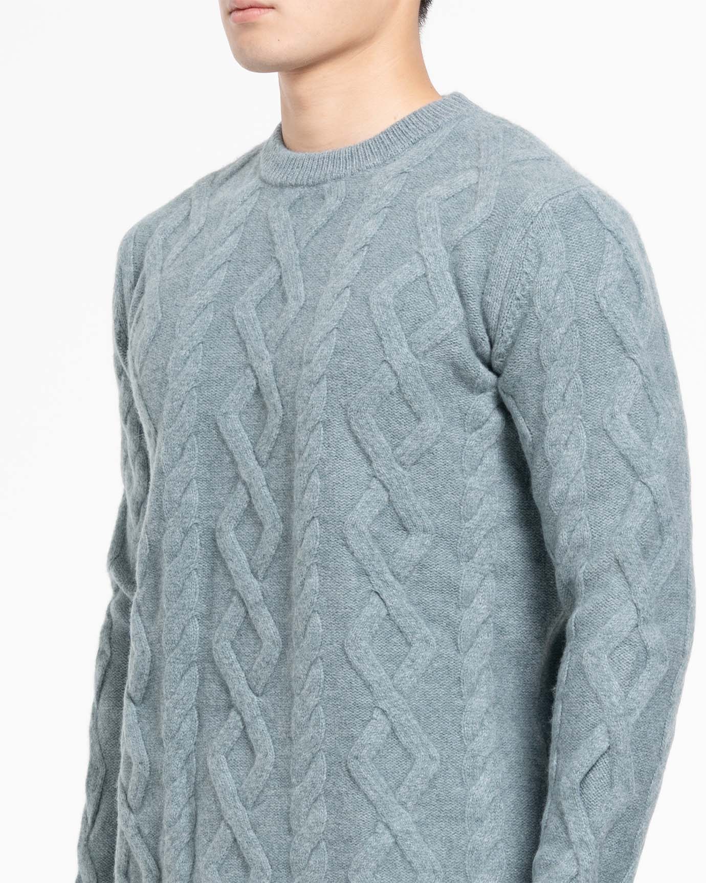 Classic men’s cashmere sweater styled with tailored trousers