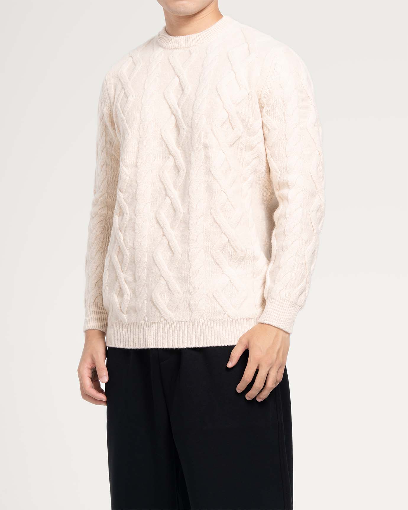 Neutral-toned cashmere sweater photographed under natural light